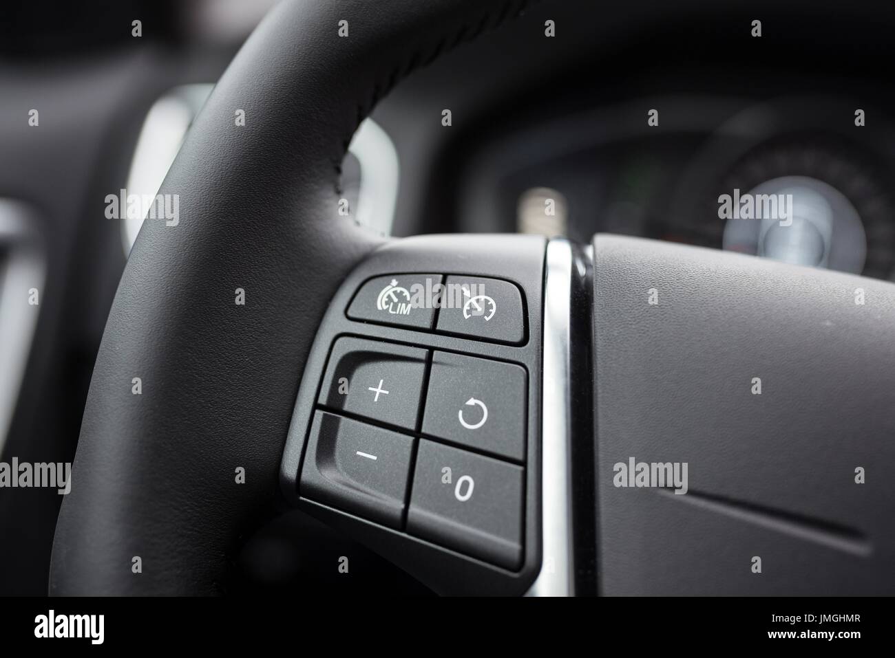 Cruise control buttons on car steering wheel Stock Photo