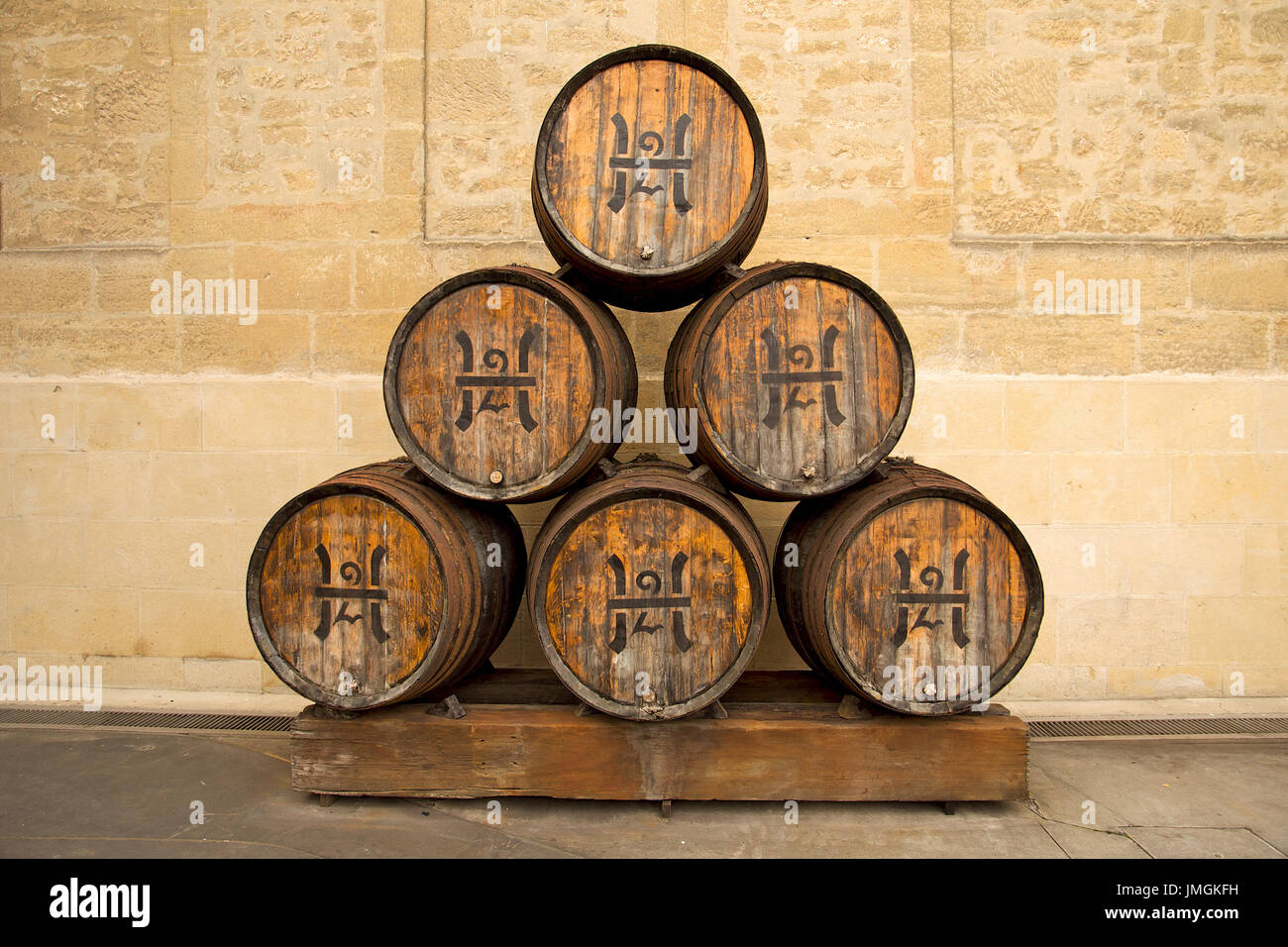 Set of six stacked wood wine barrels outside of Bodegas López de Heredia Viña Tondonia winery (Haro, La Rioja, Spain) Stock Photo