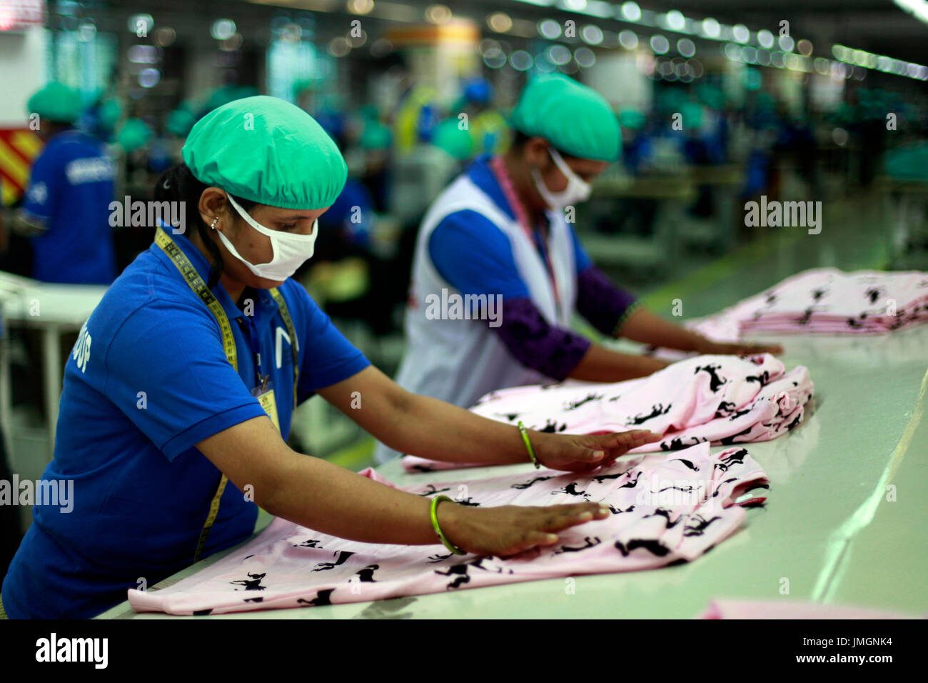 Female workers in a ready-made garment factory in Gazipur on the outskirts of Dhaka, Bangladesh on June 22, 2014. Bangladesh is the second largest app Stock Photo