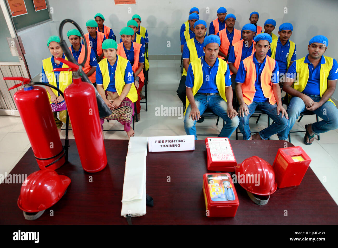 Readymade garment workers participate in a fire fighting training