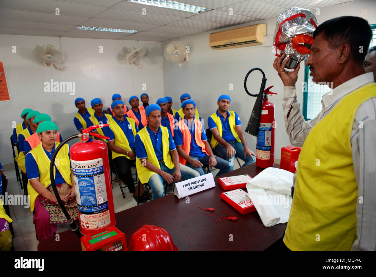 Readymade garment workers participate in a fire fighting training