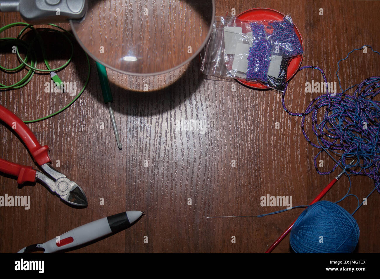tailoring tools on brown wooden table. background, border. Stock Photo
