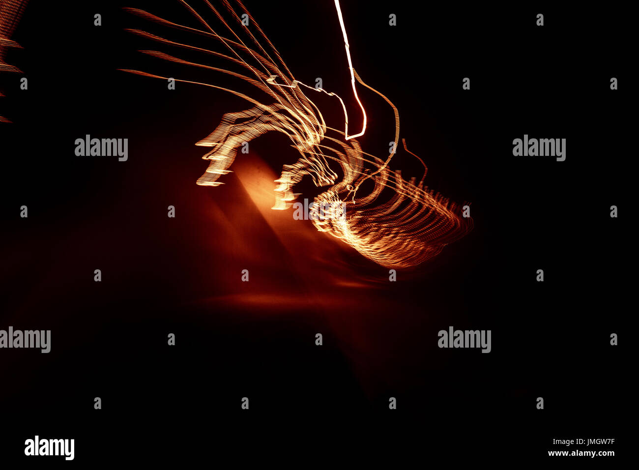 Red abstract trails of light on dark background. Long exposure Stock ...