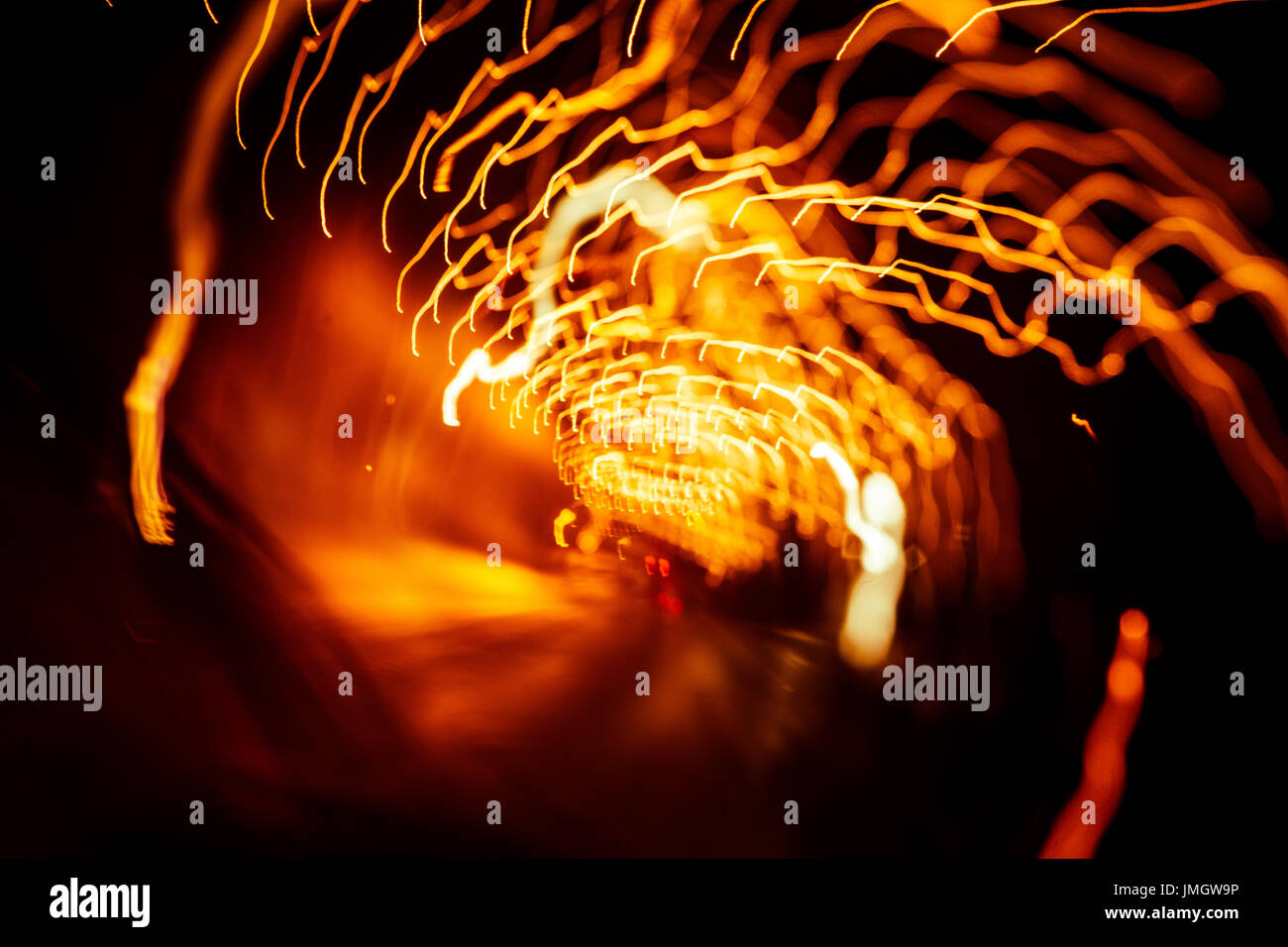 Red abstract trails of light on dark background. Long exposure Stock ...