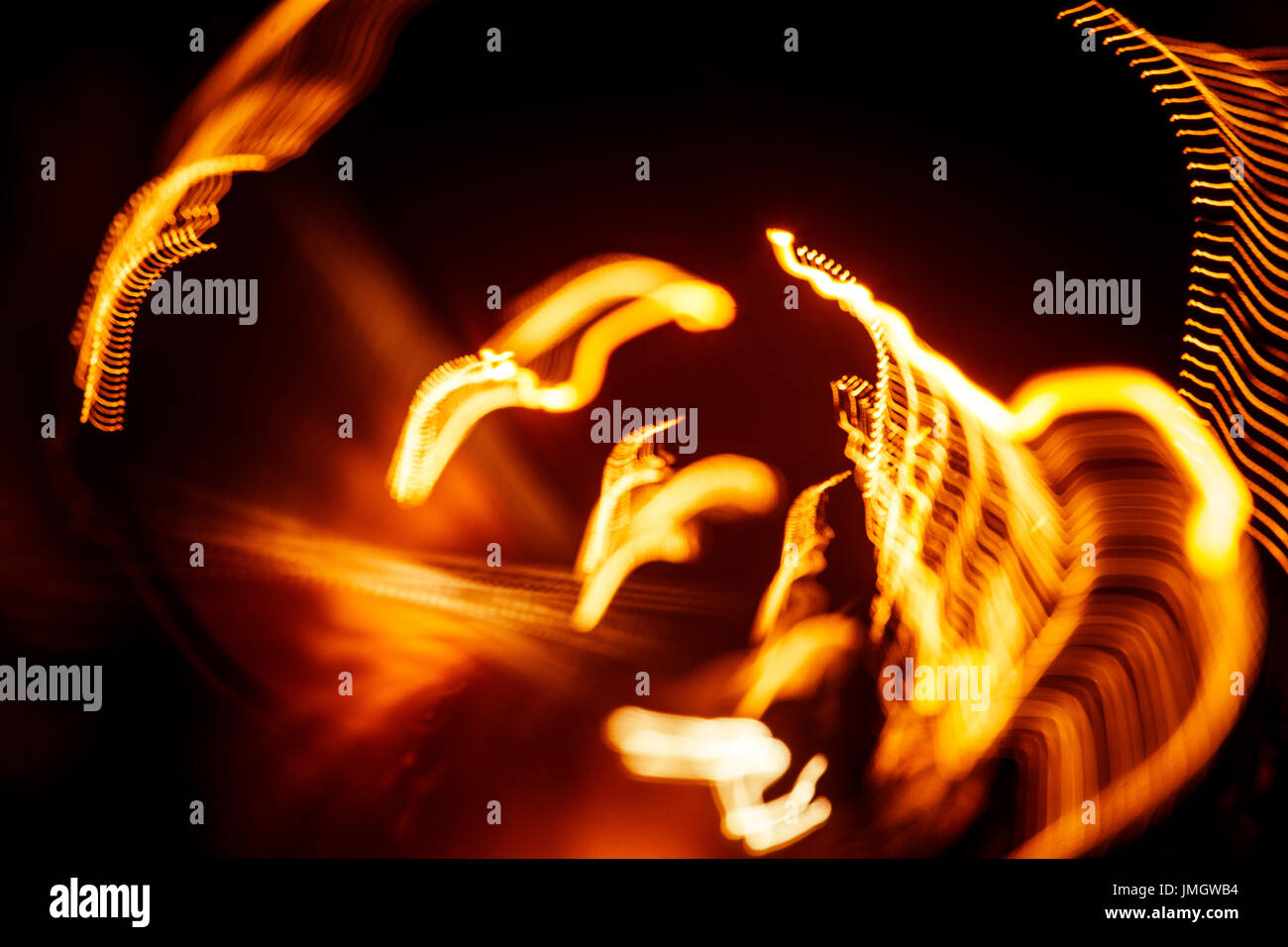 Red abstract trails of light on dark background. Long exposure Stock ...