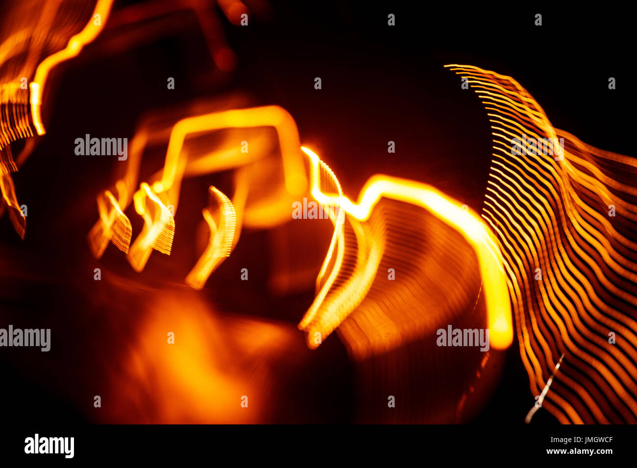 Red abstract trails of light on dark background. Long exposure Stock ...