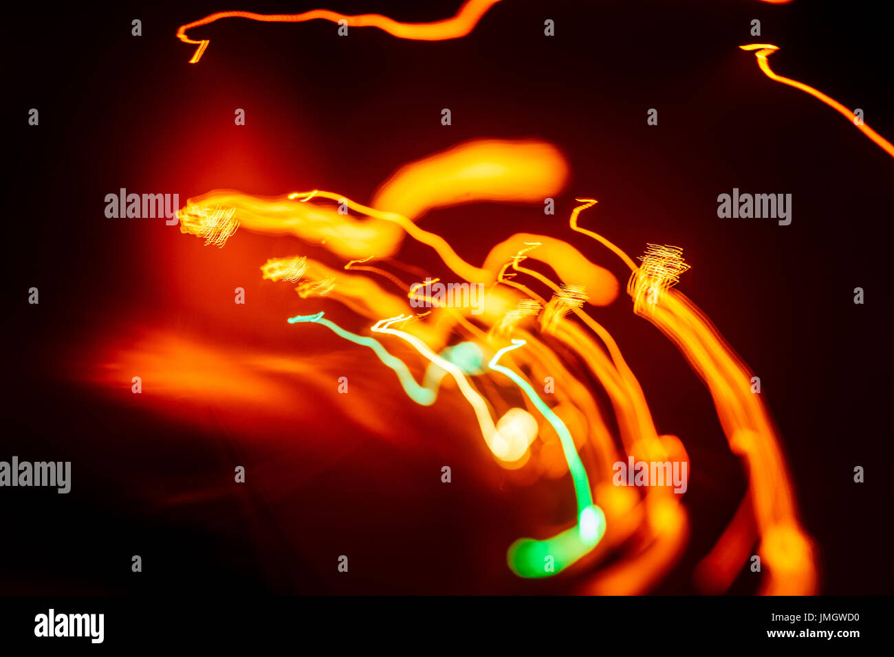 Red abstract trails of light on dark background. Long exposure Stock ...