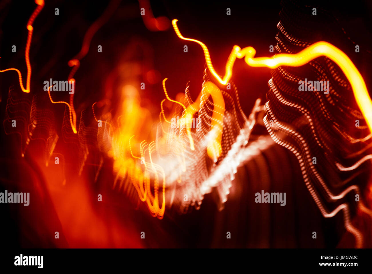 Red abstract trails of light on dark background. Long exposure Stock ...