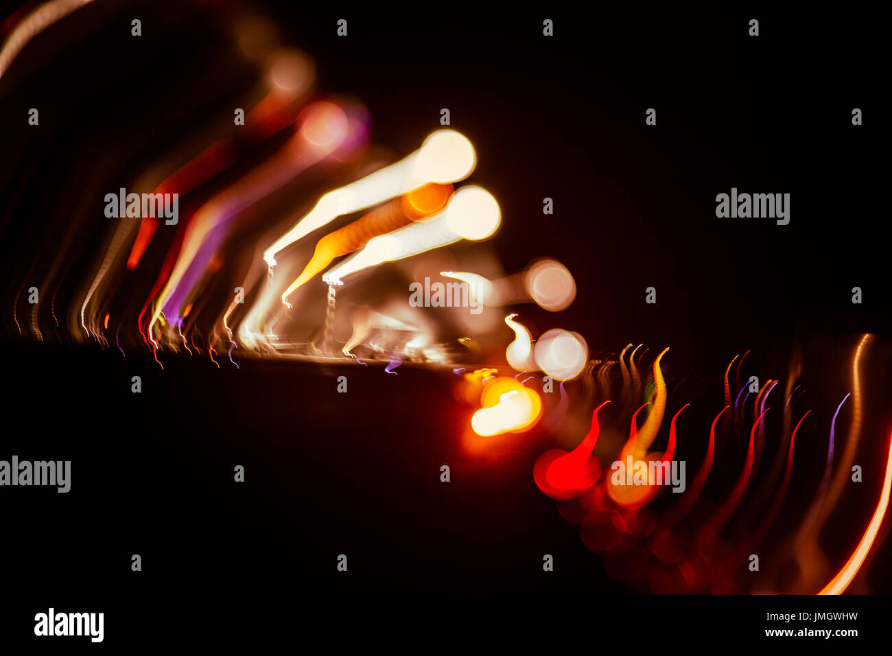 Red abstract trails of light on dark background. Long exposure Stock ...