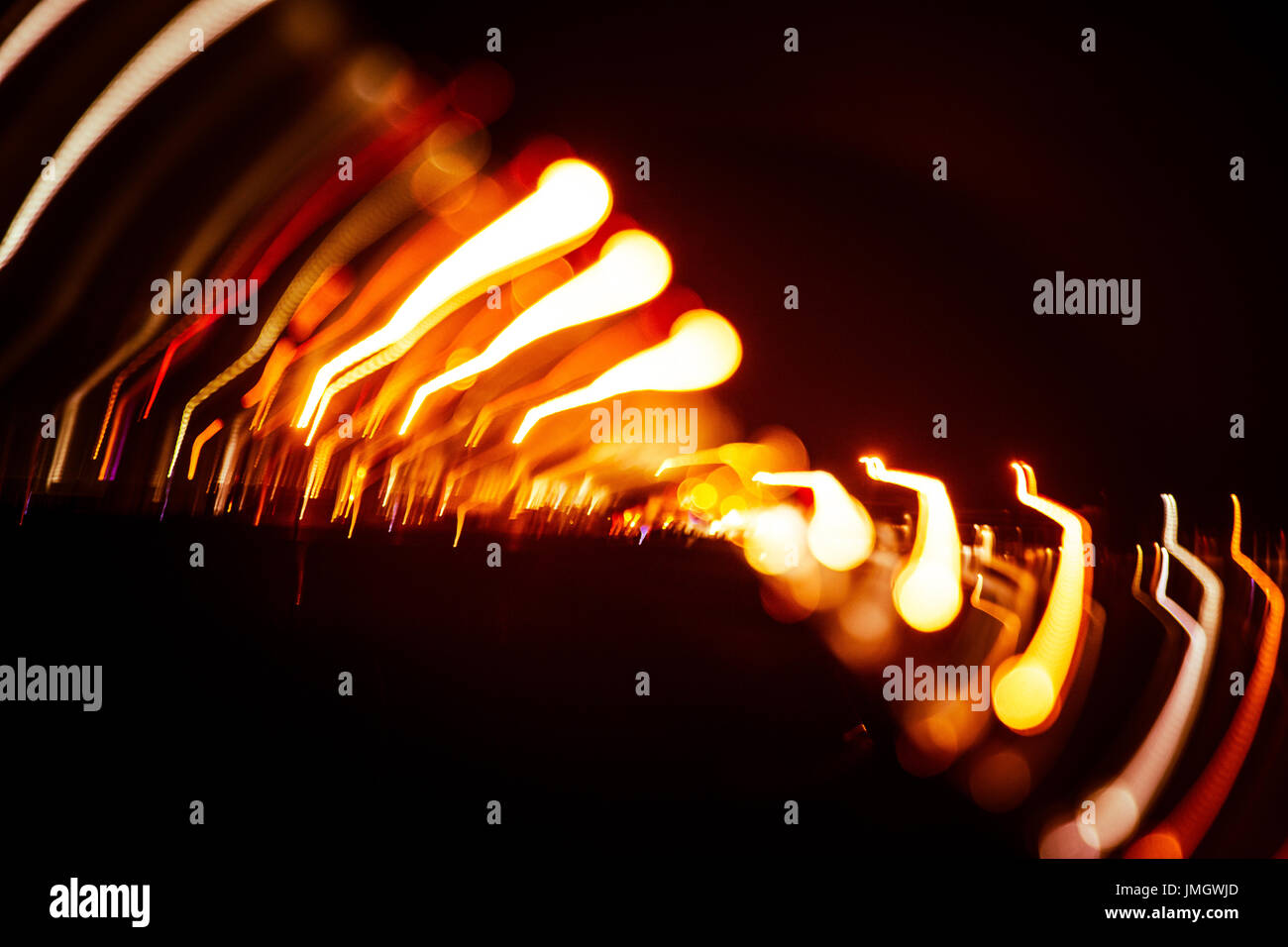 Red abstract trails of light on dark background. Long exposure Stock ...