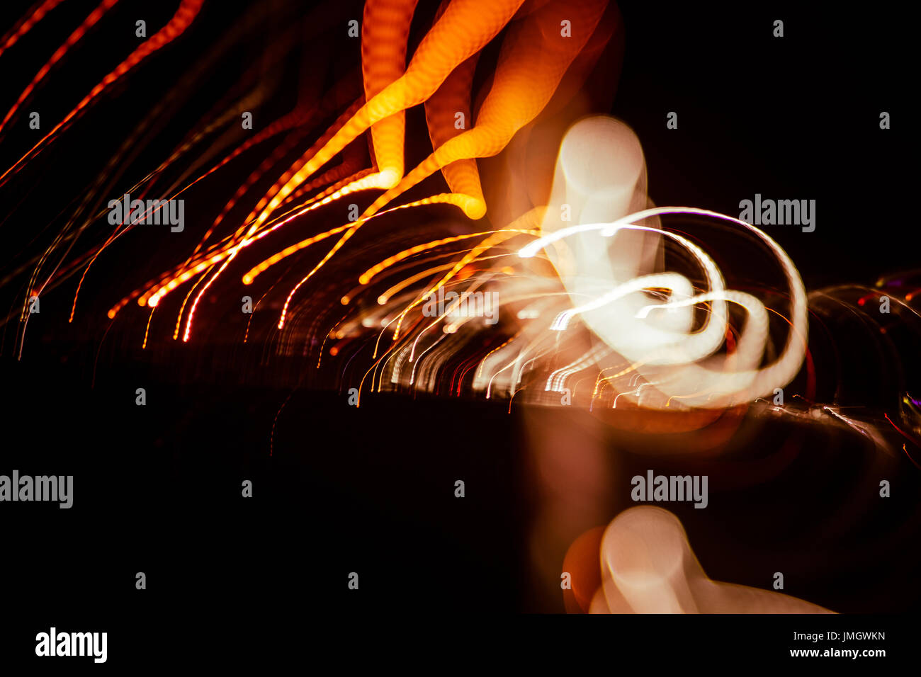 Red abstract trails of light on dark background. Long exposure Stock ...