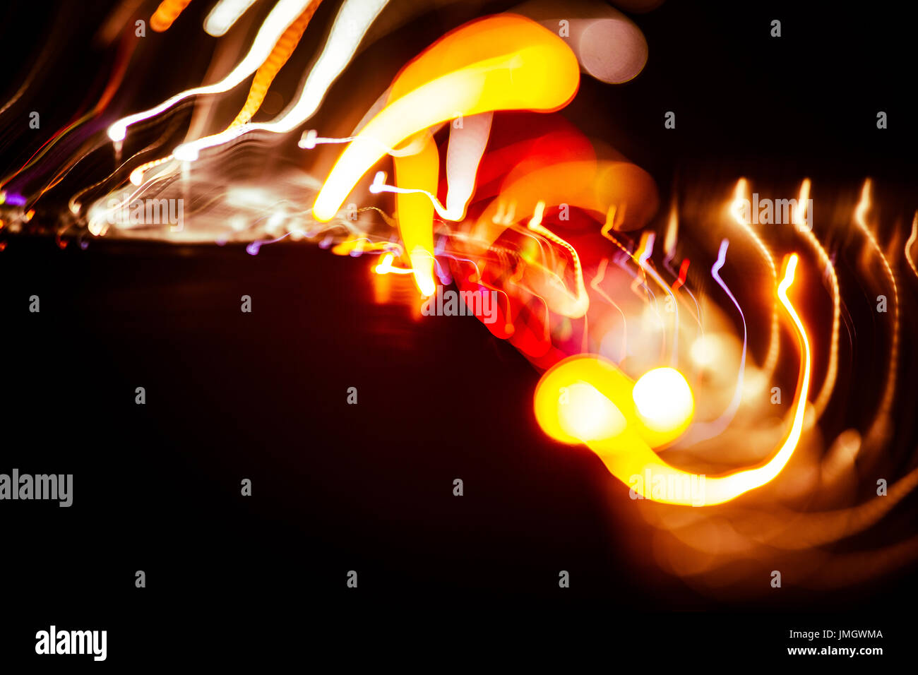 Red abstract trails of light on dark background. Long exposure Stock ...