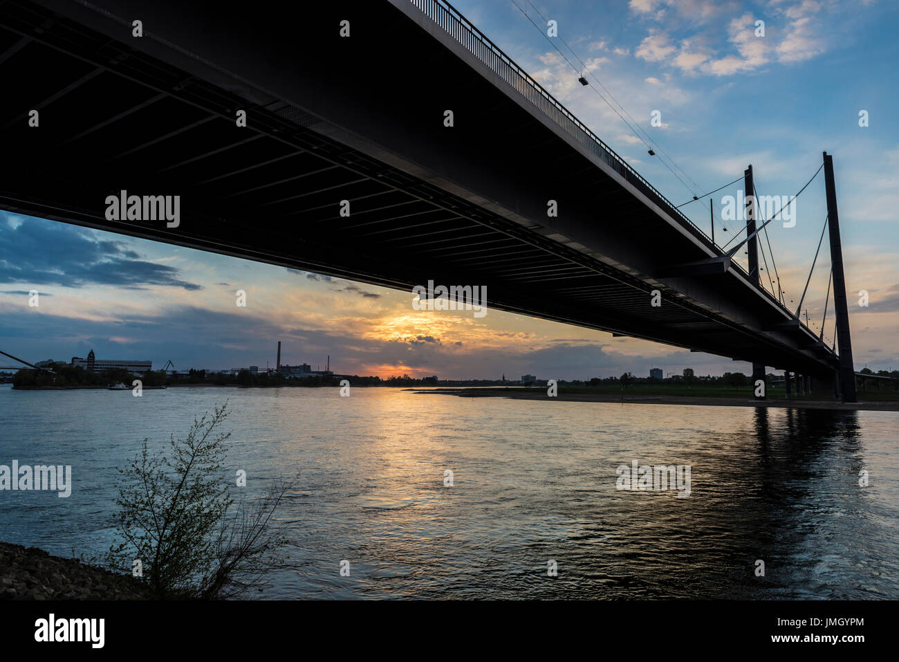 View of Oberkassel bridge at sunset in Dusseldorf, Germany Stock Photo