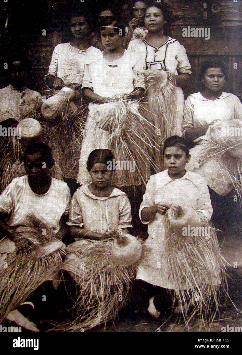 Puerto Rico (Porto Rico) women and girls manufacturing straw Panama hats. Stock Photo