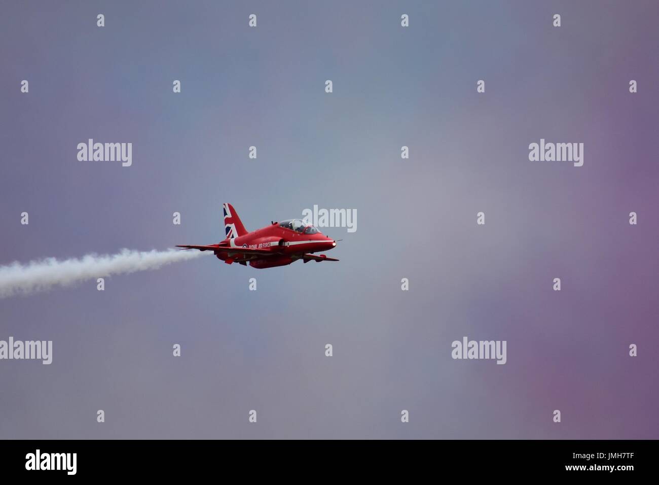 Member of the Red Arrows performing at the Royal International Air Tattoo at RAF Fairford in Gloucestershire, UK Stock Photo