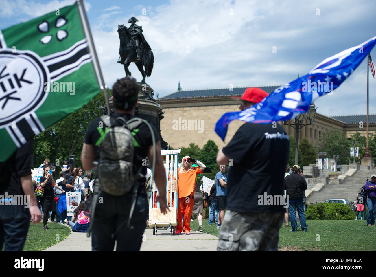 Trump supporter carries a Kekistan flag while confronting  March for Truth anti-Trump protestors in Philadelphia, PA, on June 3, 2017. Stock Photo