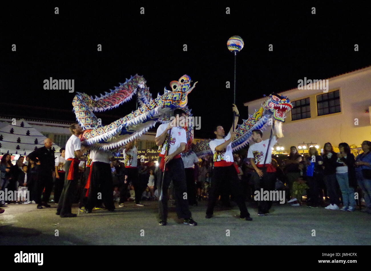 Traditional Chinese Dragon Dance at the festival: Mercado das Culturas. In Lagoa, Algarve, Portugal Stock Photo