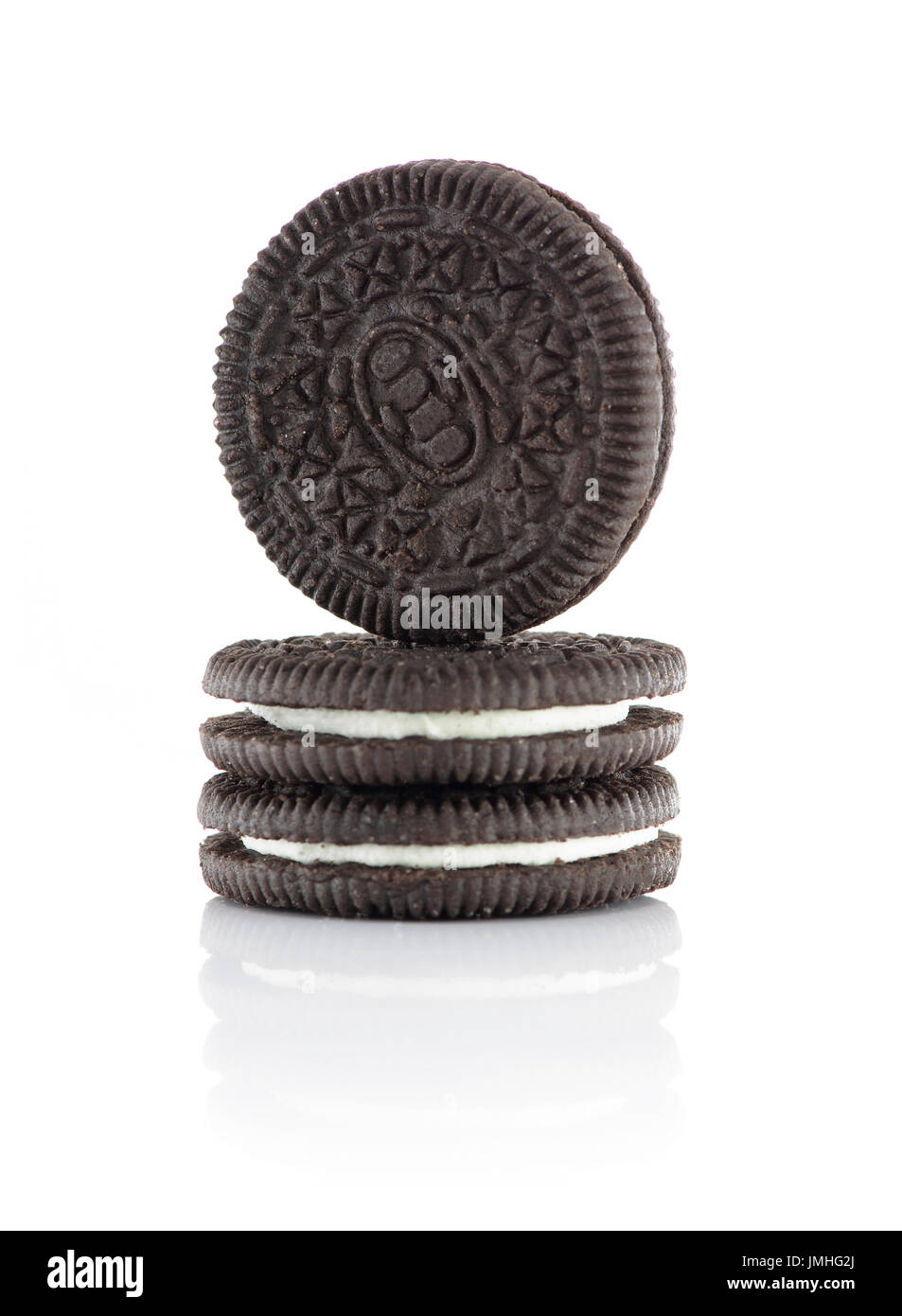 Three Chocolate Biscuits Filled With Cream Isolated on White Background Stock Photo