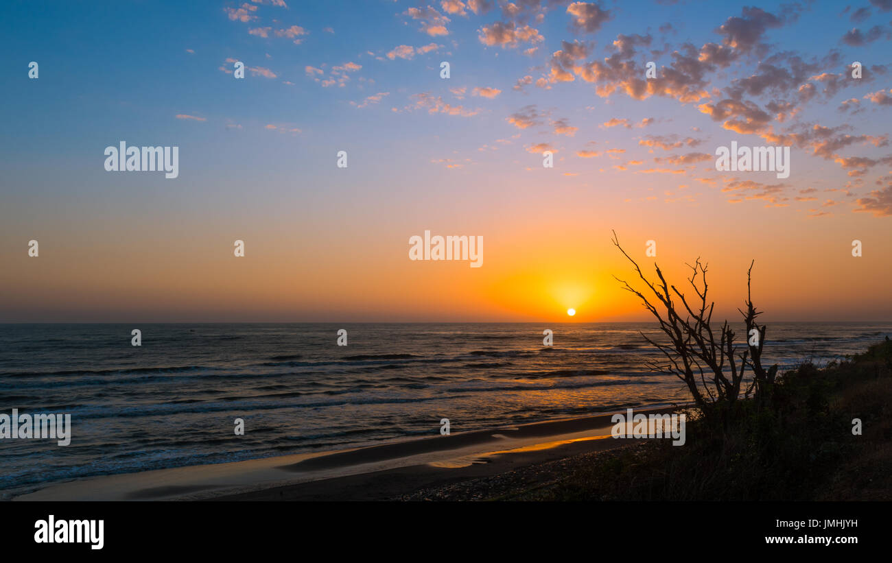 Bright colorful sunrise at sea Stock Photo - Alamy