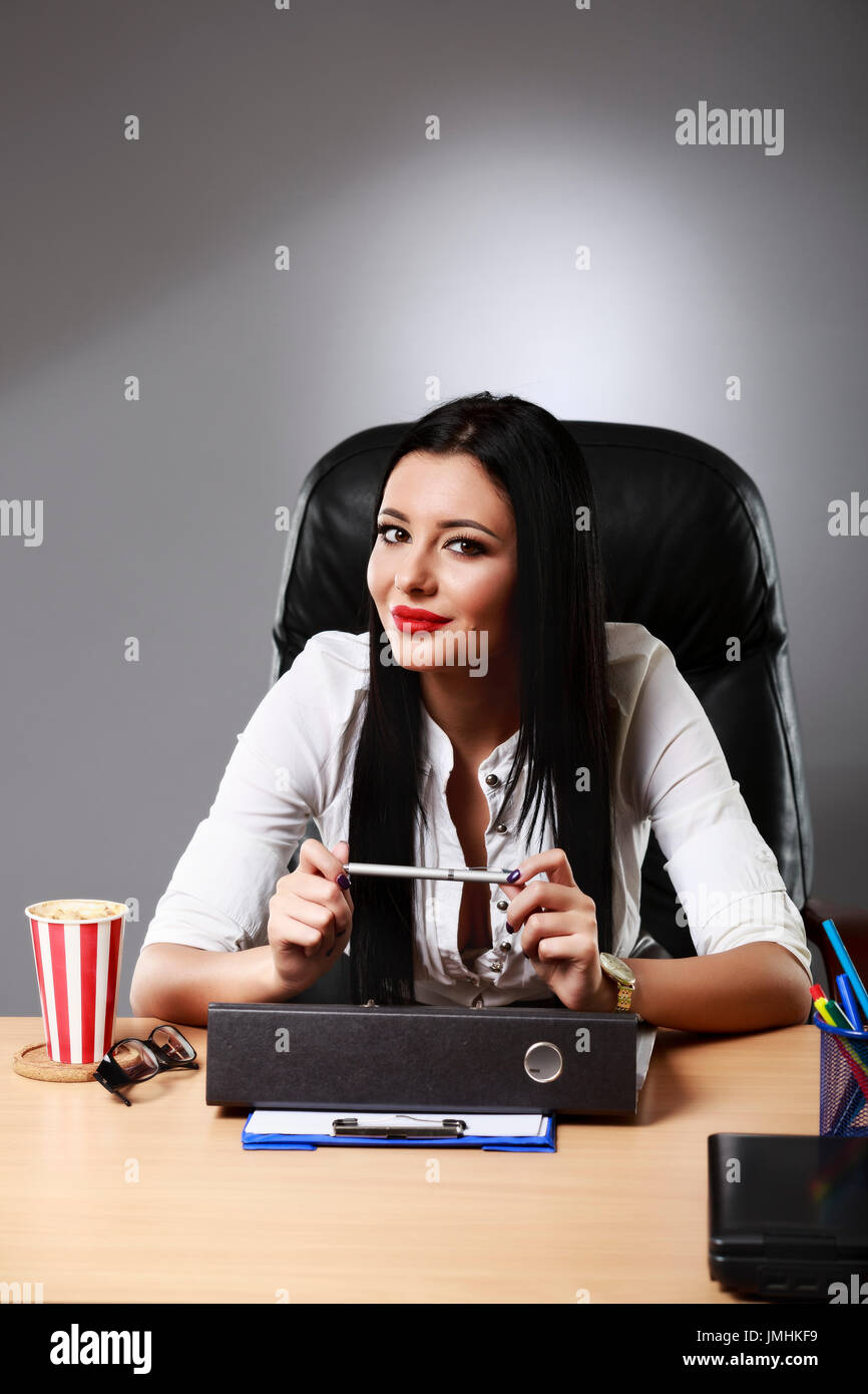 Adult young pretty business woman working at her office Stock Photo - Alamy