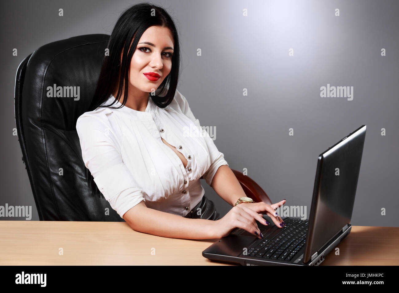 Adult young pretty business woman working at her office Stock Photo - Alamy