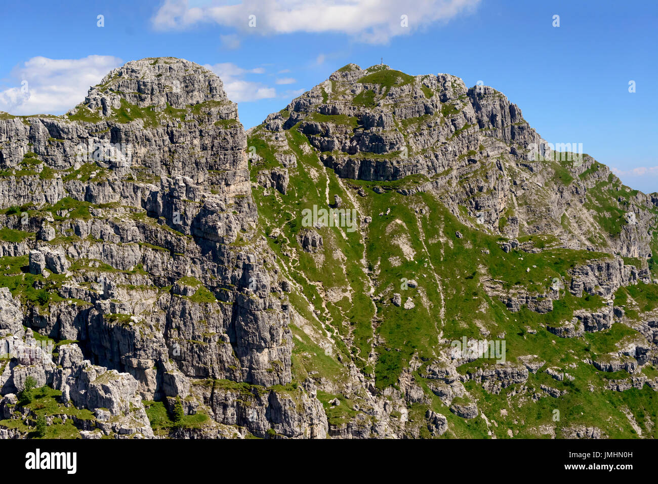 aerial shot, from a small plane, of the mountaintop of Resegone peak, shot on a bright summer day in Orobie mountains, Bergamo , Italy Stock Photo