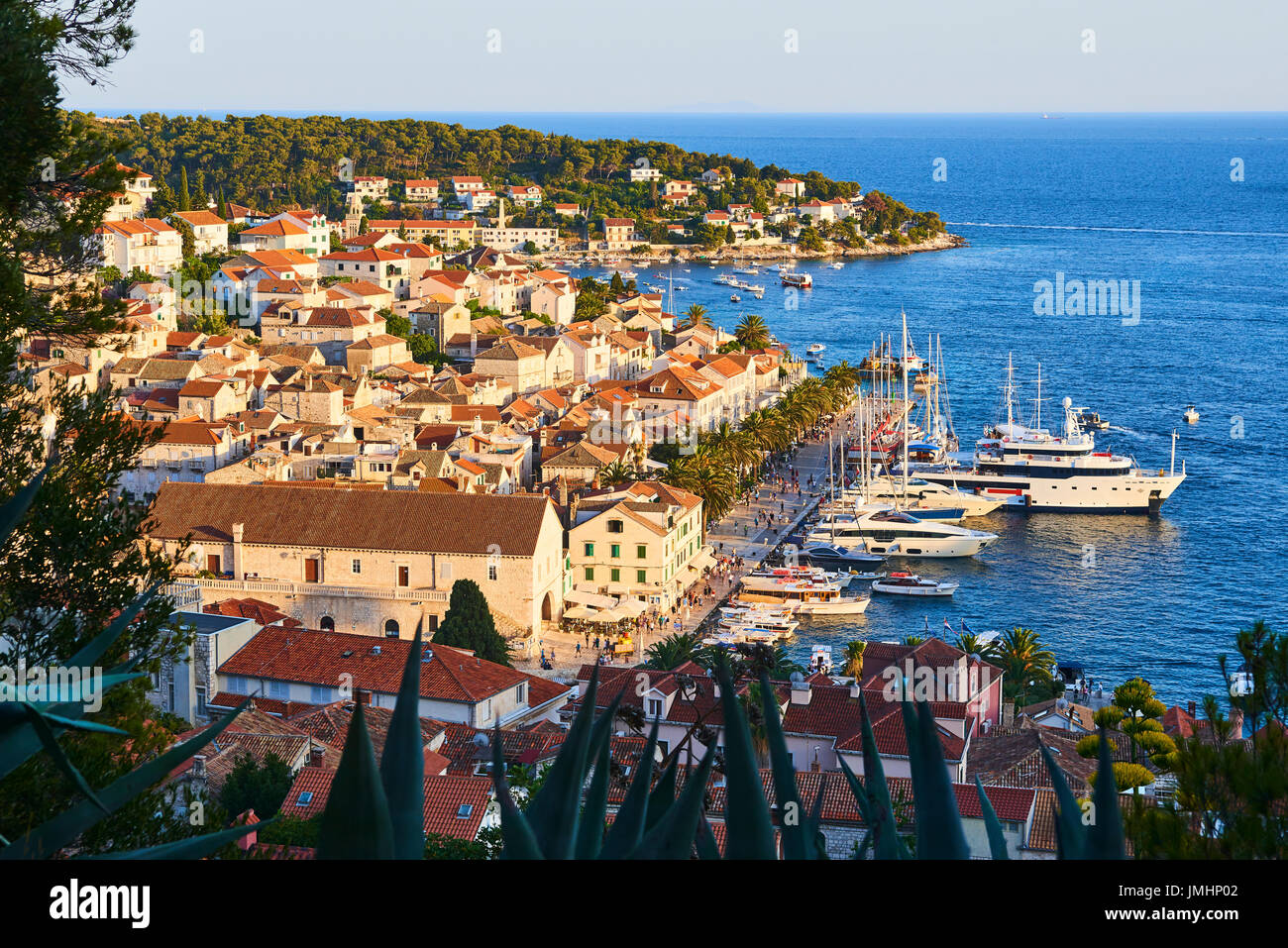 Amazing sunset over Hvar city and bay with yachts, Hvar island, Croatia ...
