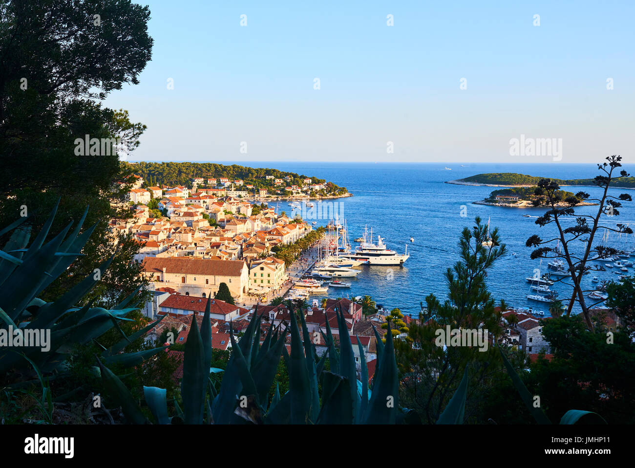 Amazing sunset over Hvar city and bay with yachts, Hvar island, Croatia ...