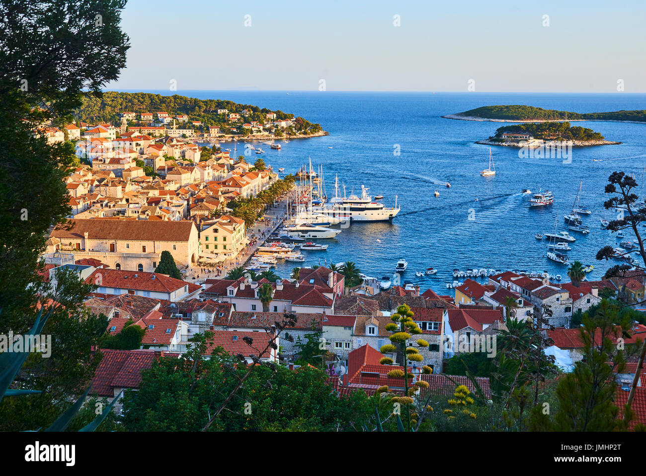 Amazing sunset over Hvar city and bay with yachts, Hvar island, Croatia ...