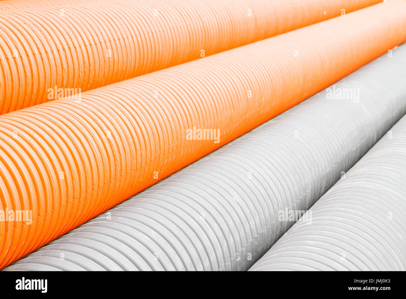 Construction orange and black plastic pipes Stock Photo Alamy