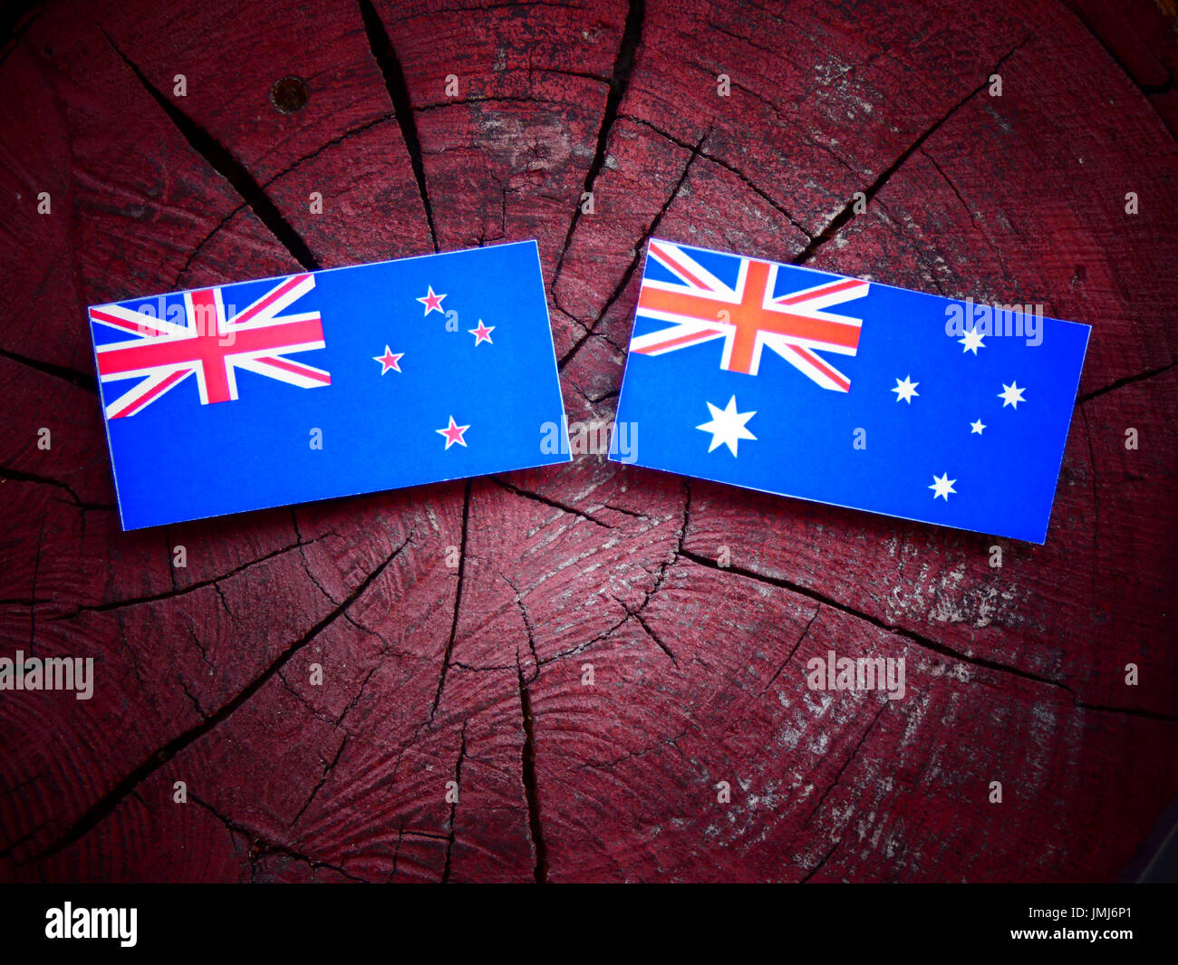 New Zealand flag with Australian flag on a tree stump isolated Stock Photo  - Alamy