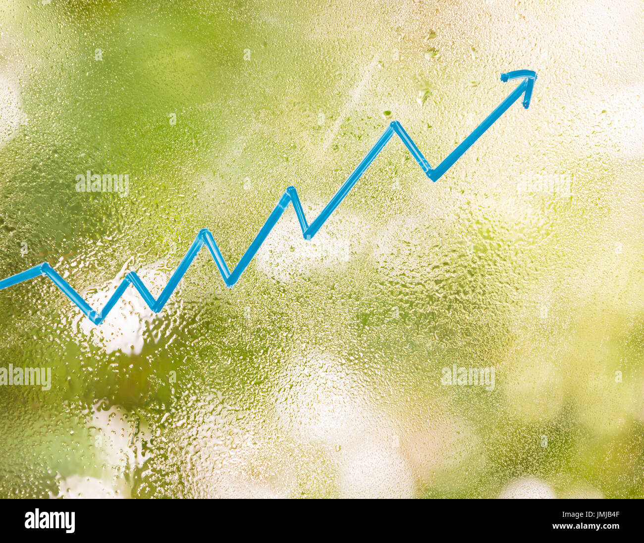 blue wave graph on blurred greenery background Stock Photo - Alamy