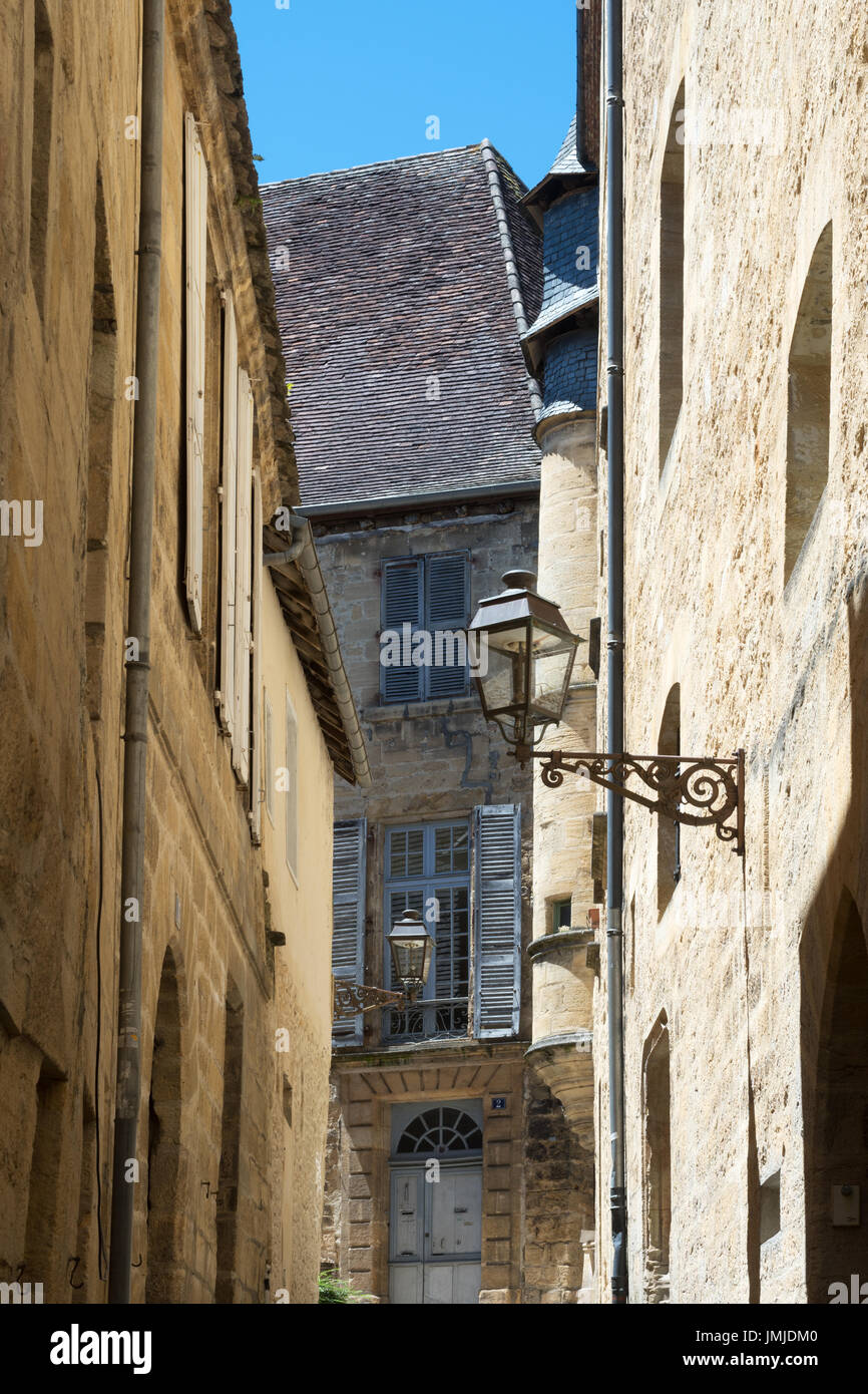 A narrow street within the old town of Sarlat-la-Canéda, Dordogne, France Stock Photo