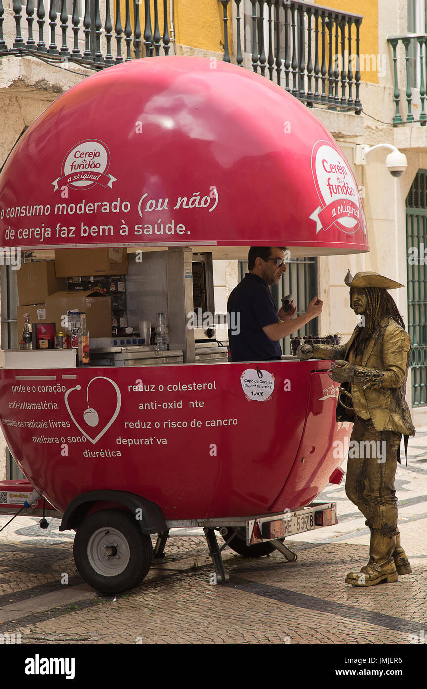 Street entertainer dressed as Pirates of the Caribbean taking a break in Lisbon Portugal Stock Photo