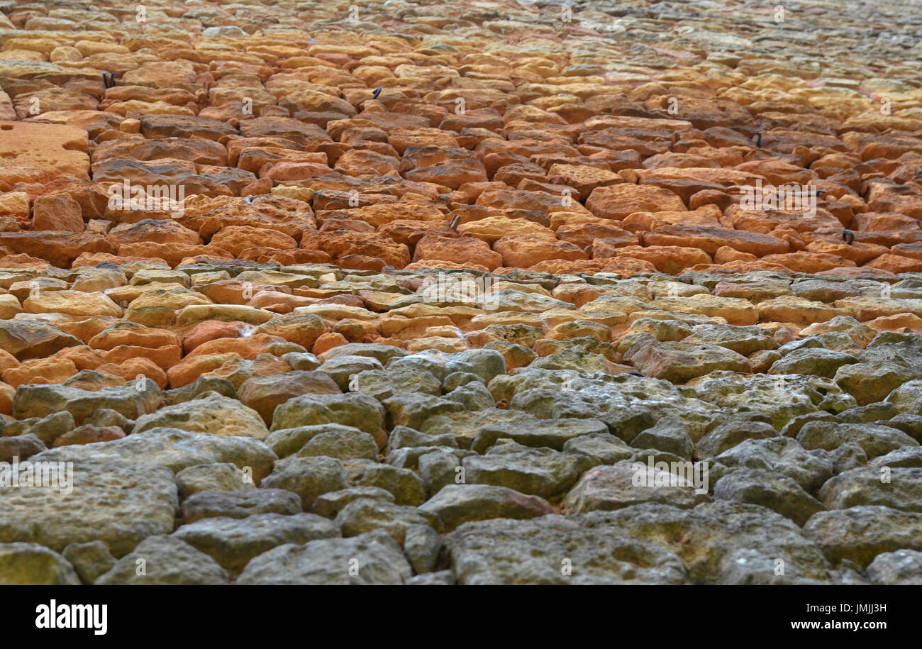 Unusual stone pattern with different colours of stone Stock Photo - Alamy