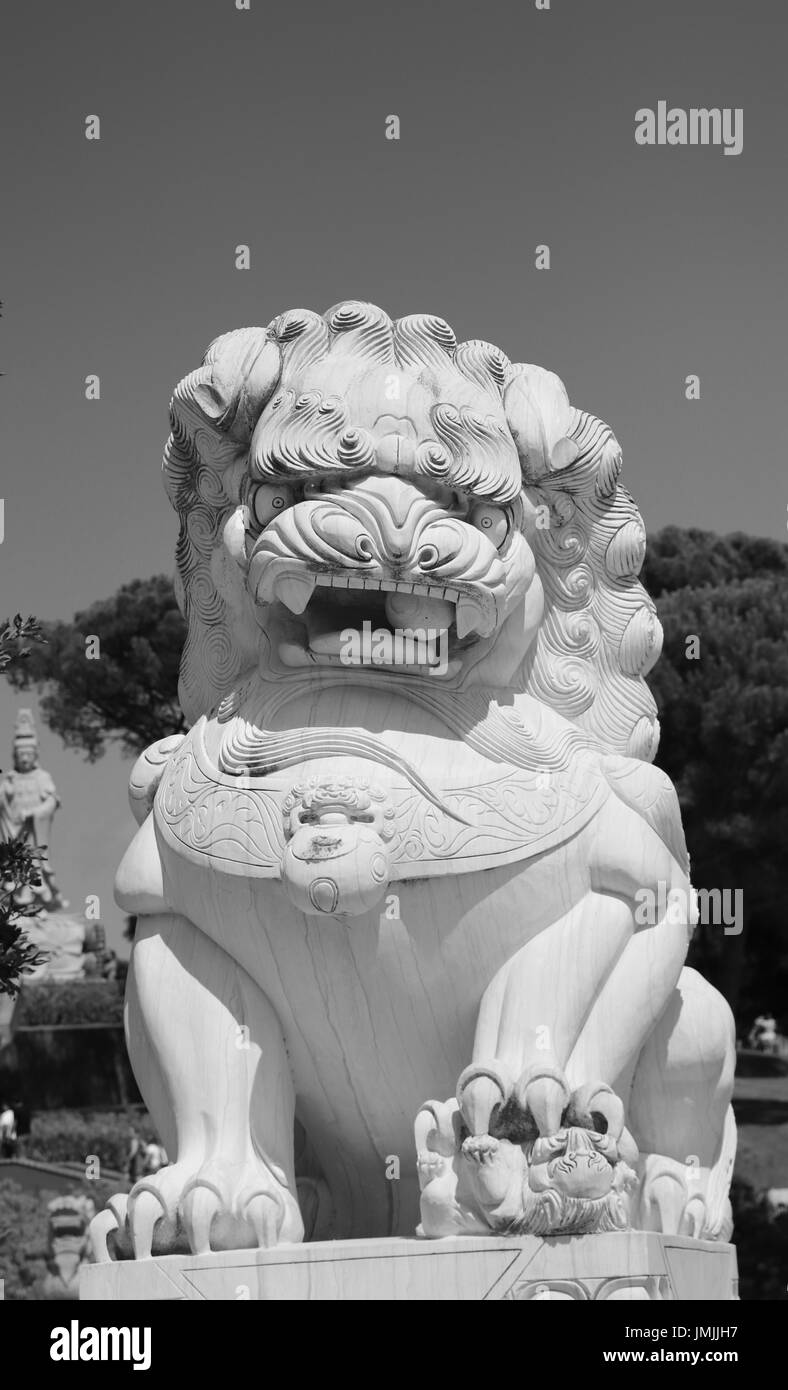 Chinese lion stone statue. Oriental statue Stock Photo