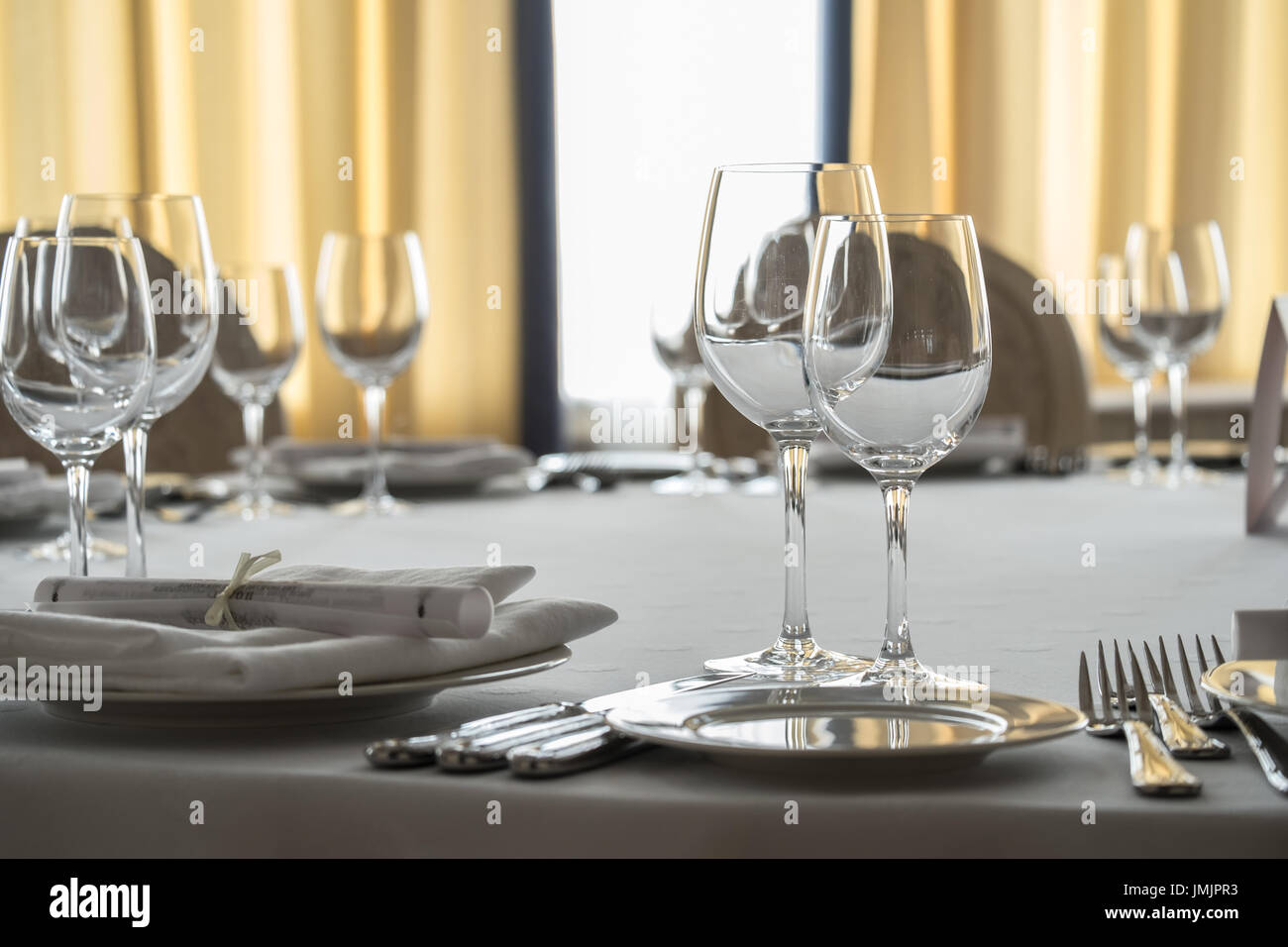 Empty glasses and plates set on the table in the restaurant Stock Photo ...