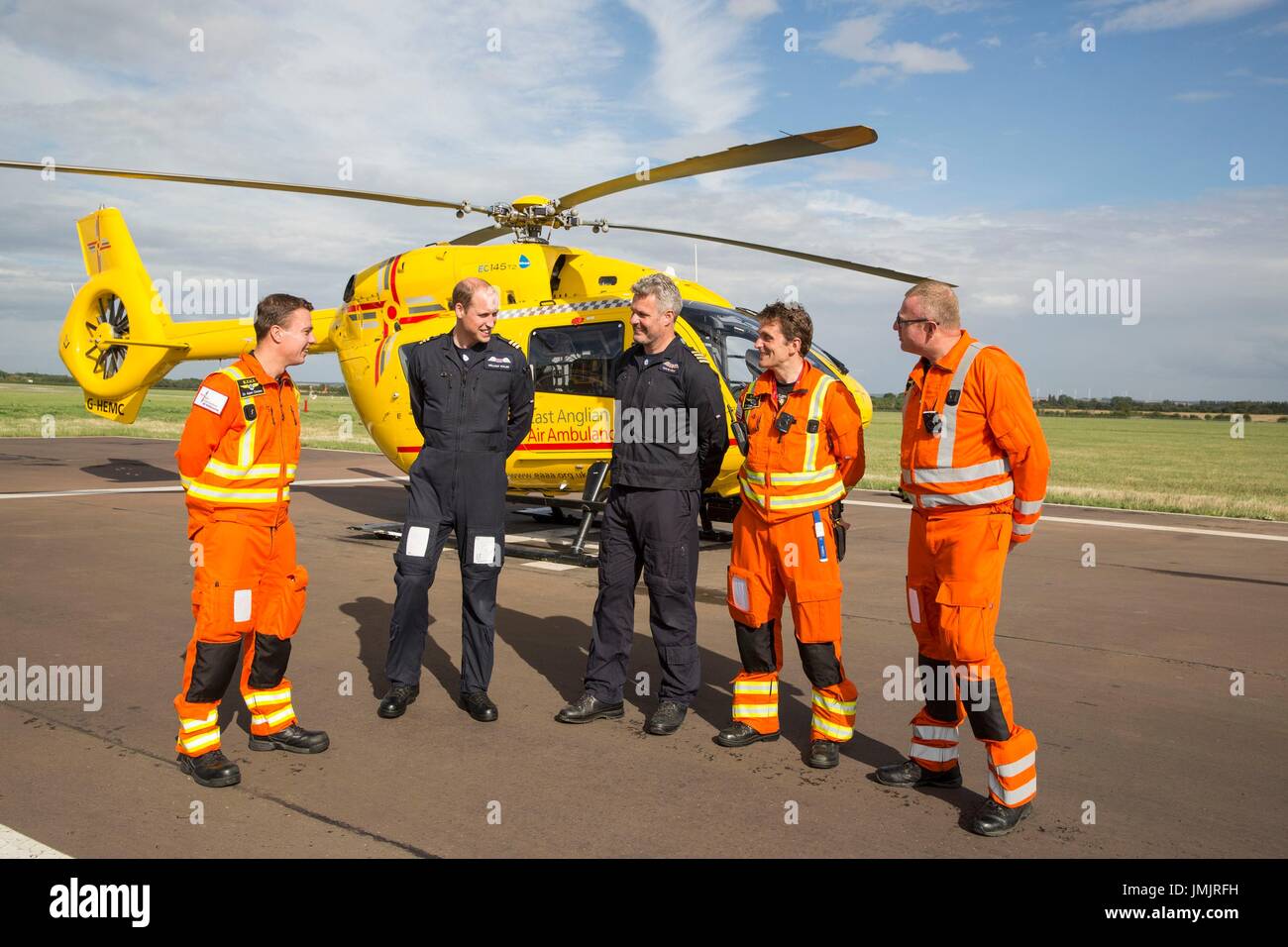The Duke of Cambridge Poses for a final photo with the night shift crew as he starts his final shift with the East Anglian Air Ambulance based at Marshall Airport near Cambridge. (left to right) Dr Adam Chesters, Prince William, Cpt Dave Kelly, Dr Tobias Gouse and CCP Carl Smith. Stock Photo