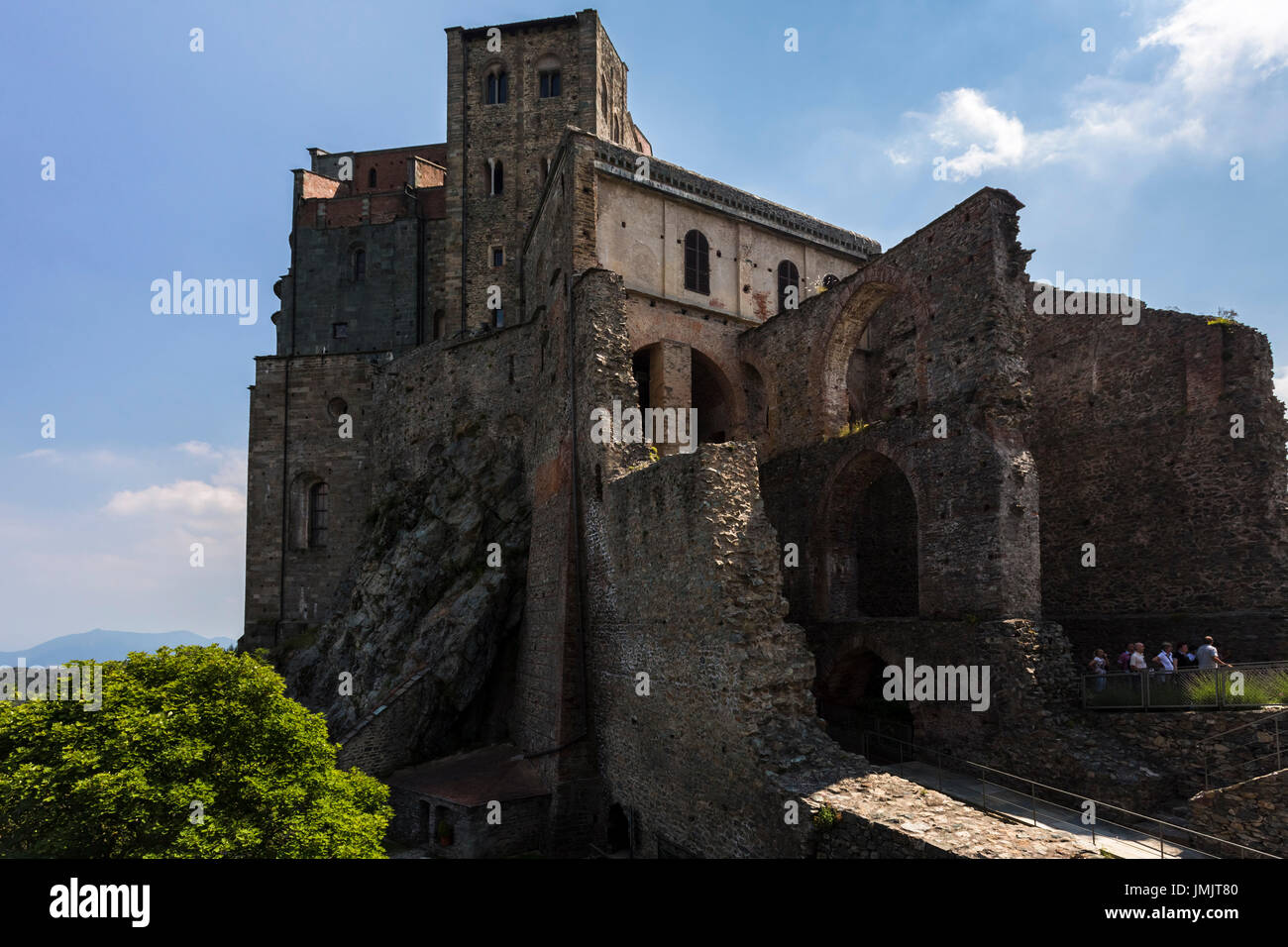 View of the Sacra di San Michele from the ruins of the New Monastery. Sant'Ambrogio di Torino, Val di Susa, Torino district, Piedmont, Italy. Stock Photo