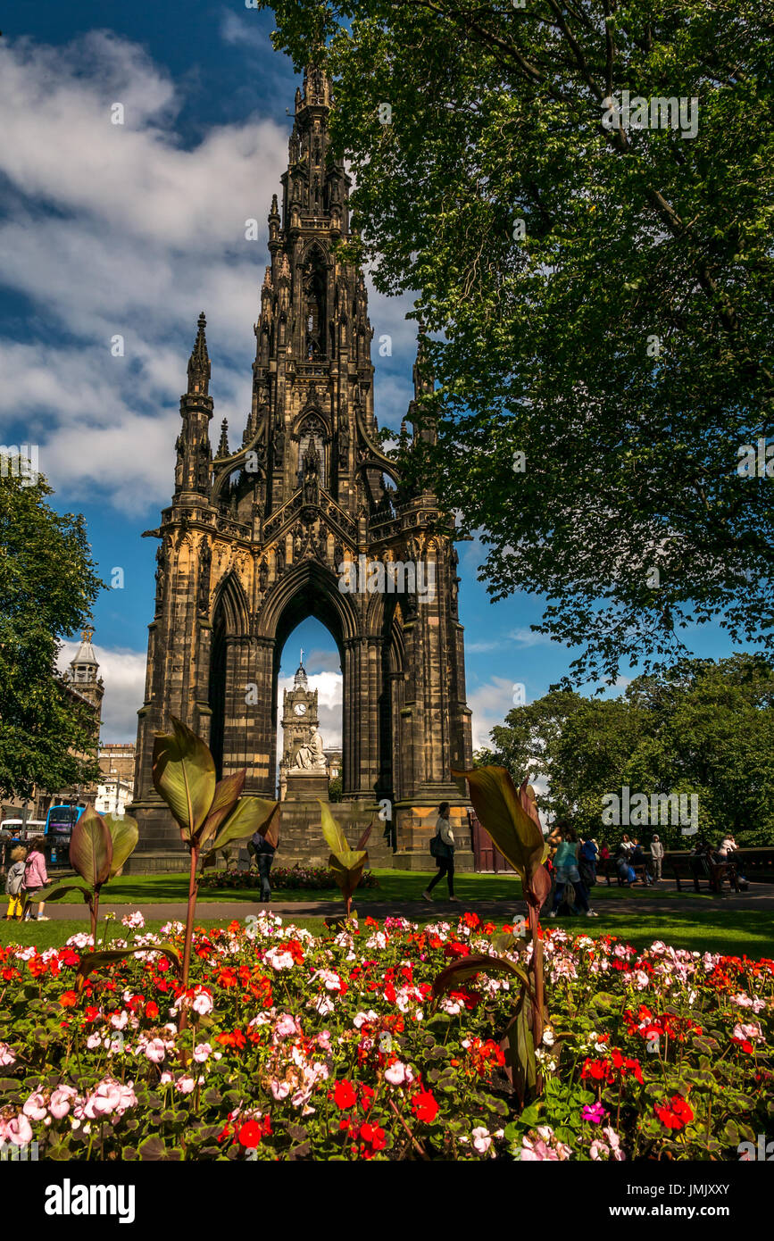 Scott monument, Princes Street, Edinburgh, Scotland, UK, by George Meikle Kemp, with statue of Sir Walter Scott by John Steell and colourful flowers Stock Photo