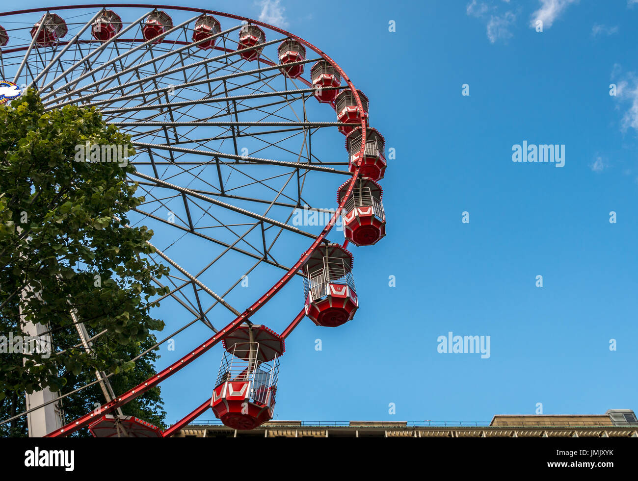Skyward view of Edinburgh Festival big Ferris wheel, Princes Street gardens, Scotland, UK, at festival time with blue sky Stock Photo