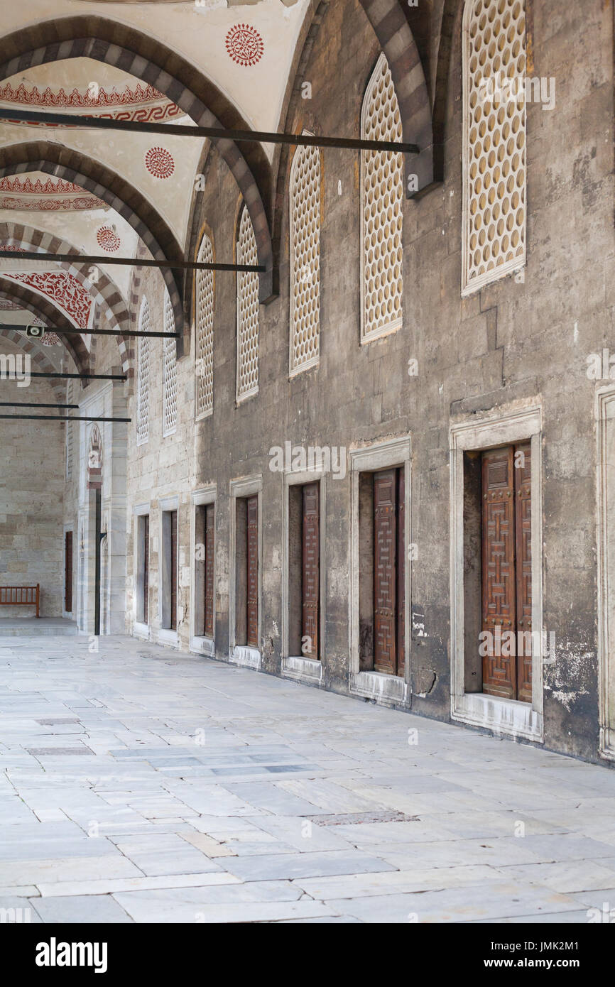 Arched ceiling Portico with doors in a row in the courtyard of an ancient mosque Stock Photo