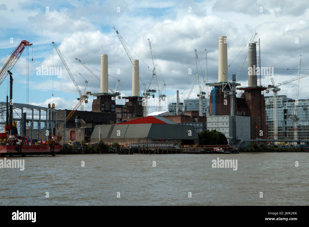 The iconic Battersea Power Station, London UK undergoing extensive redevelopment. Taken from a boat on the River Thames Stock Photo