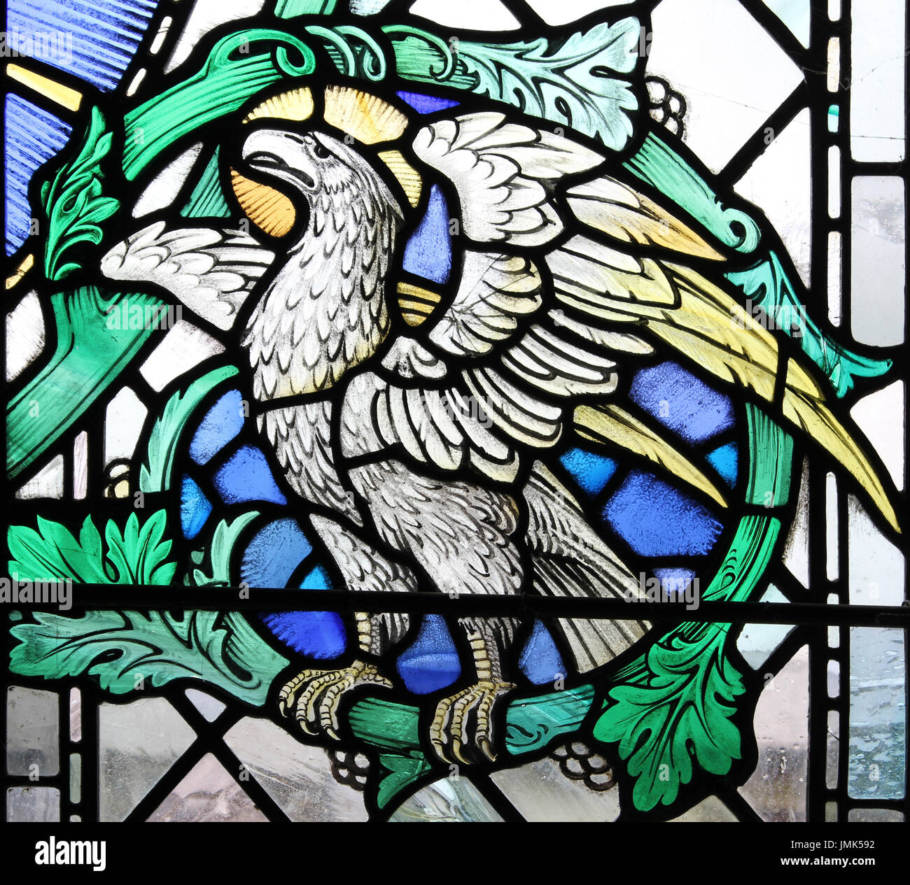 Stained Glass Window depicting an Eagle - one of the four Apocalyptic beasts - this symbolizing John the Evangelist Stock Photo