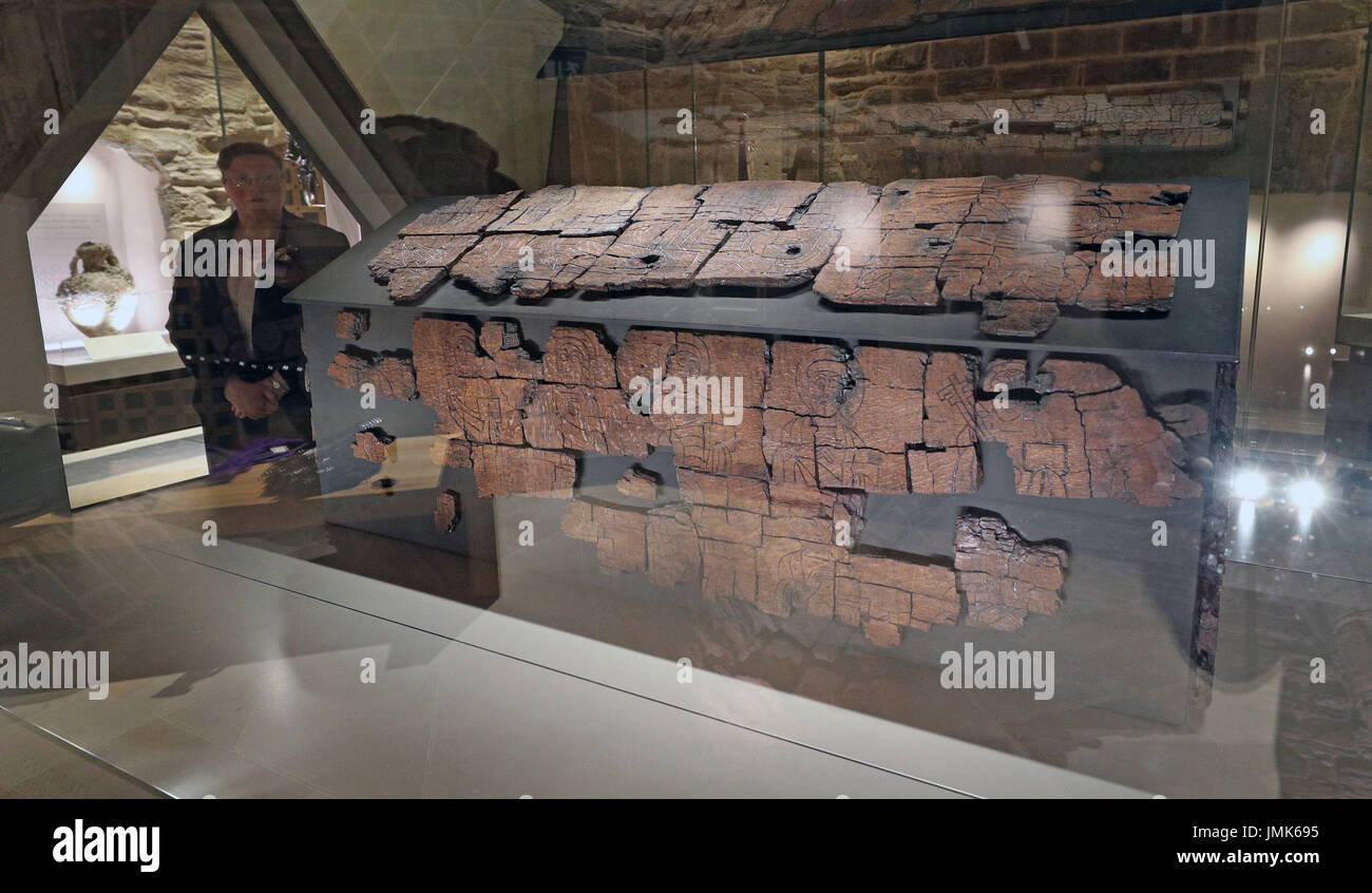 Exhibition officer Marie-Therese Mayne looks at the 1,300-year-old coffin of St Cuthbert in Durham Cathedral, one of a number of significant Anglo-Saxon artefacts which have gone on display at the cathedral. Stock Photo