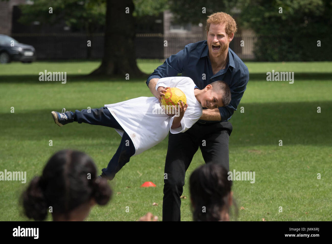 Prince Harry during a visit to a summer holiday activity session run by Newham Council's leisure trust at Central Park, East Ham, London. Stock Photo
