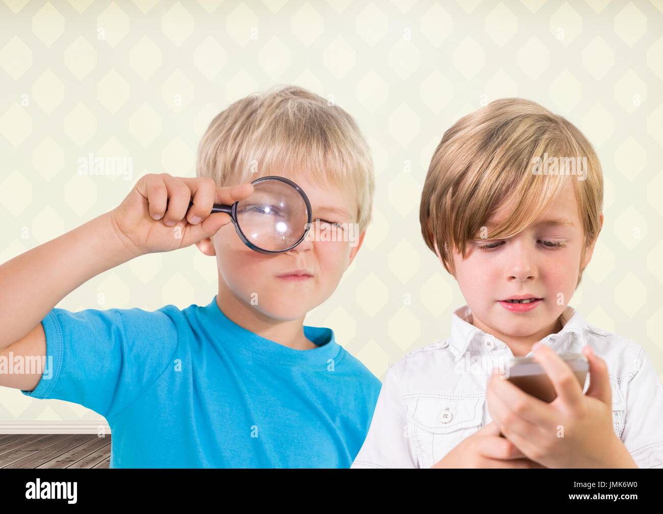 Digital composite of kids holding magnifying glass with blank room ...