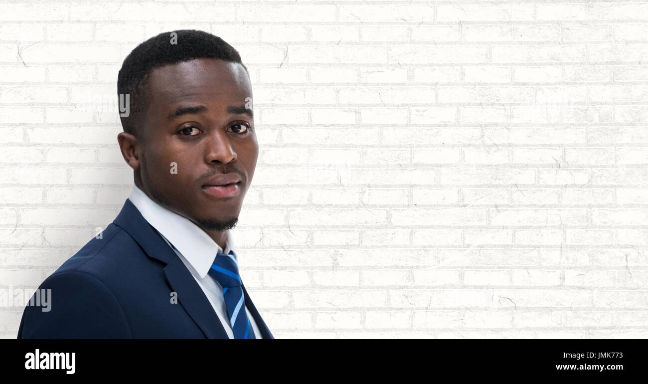Digital composite of Business man standing against white wall ...