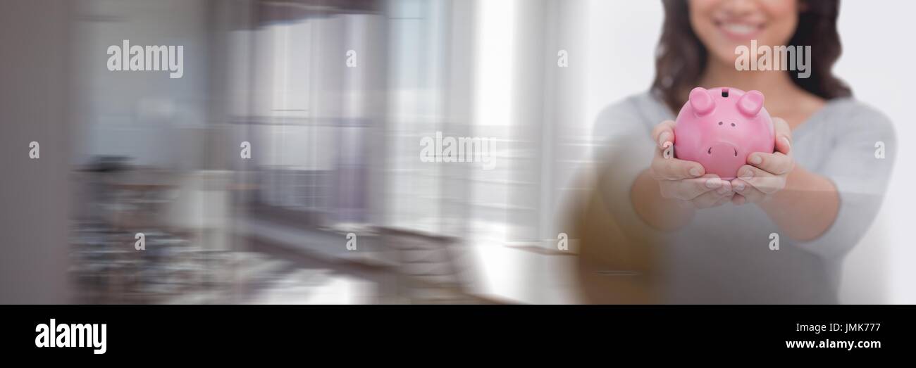 Digital composite of Happy woman holding a piggy bank Stock Photo - Alamy