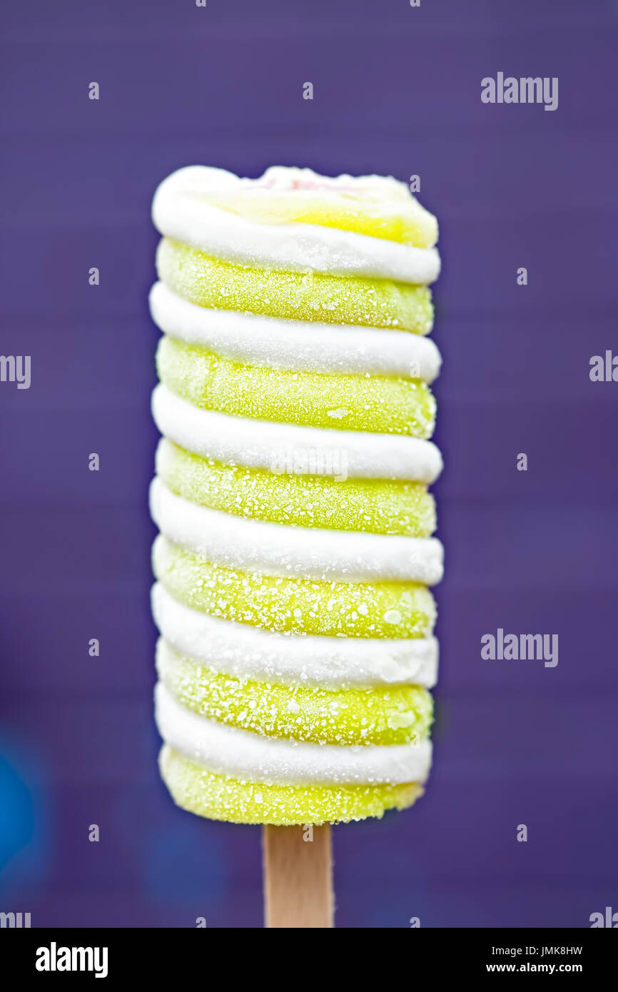 Twister pineapple, lime, strawberry centre ice cream lollipop on stick